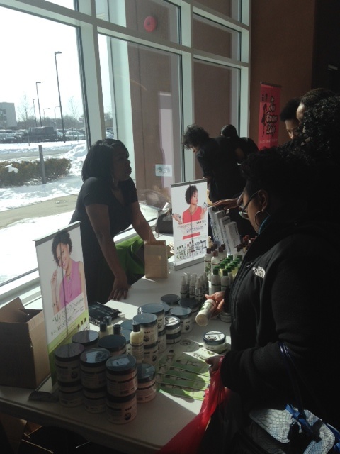 Eden Body Work's Brand Ambassador Nikki of Nikki & The City helping customers find the perfect natural hair product.